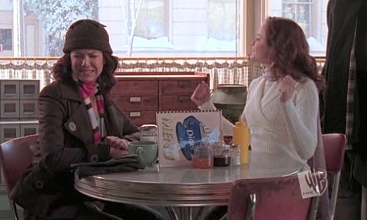 Lorelai and Rory at Luke's, cringing and whooping respectively