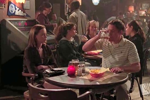 Rory sat in the bar with Graham chugging a beer
