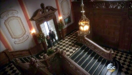 A different angle on the staircase showcasing the distinctive checkerboard floor