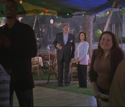 Richard and Emily framed in the rain, in the season seven finale