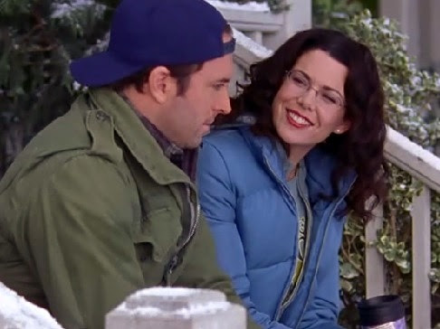 Lorelai and Luke on her porch steps, with glasses