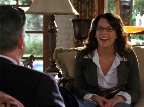 Lorelai opposite Poppa Gilmore, with glasses