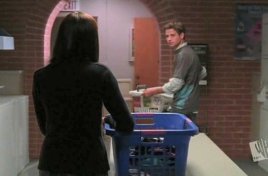 Rory and William having an (awkward) moment in the laundry room