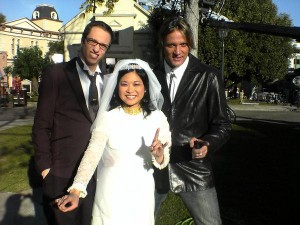 A candid behind-the-scenes photo of John Cabrera, Keiko Agena and Sebastian Bach
